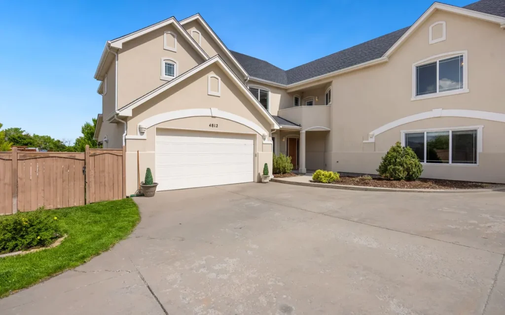 Large home with a white double garage door in Bothell