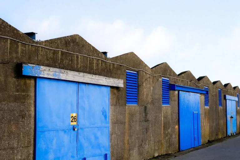 Row of blue roll-up commercial doors