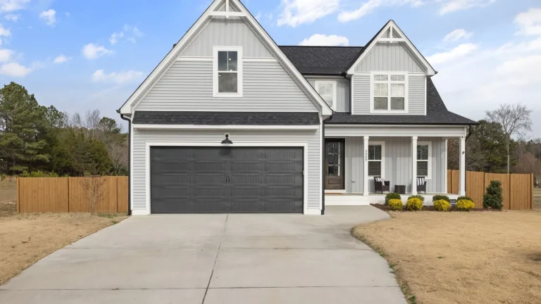 Gray two-story home with a dark double garage door, garage door repair in Redmond