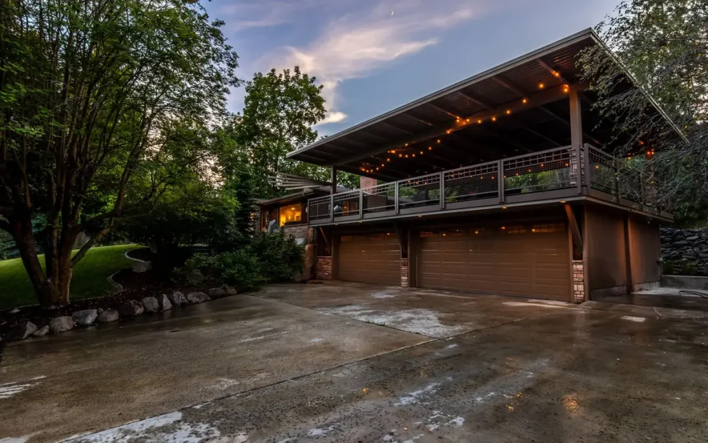 Home with a three-car garage under a covered deck in Kirkland