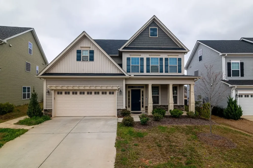 New raised-panel garage door on a craftsman-style home