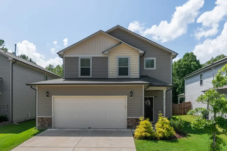 Traditional raised-panel garage door on a two-story home